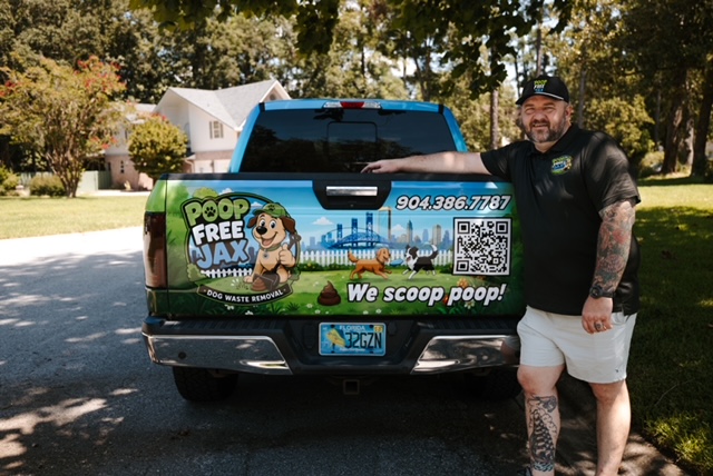 Poop Free Jax service truck with the signup QR code on the tailgate
